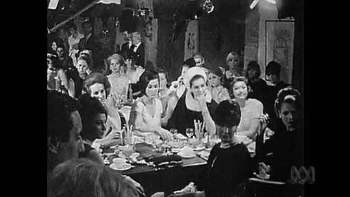 A group of women sit around a dinner table