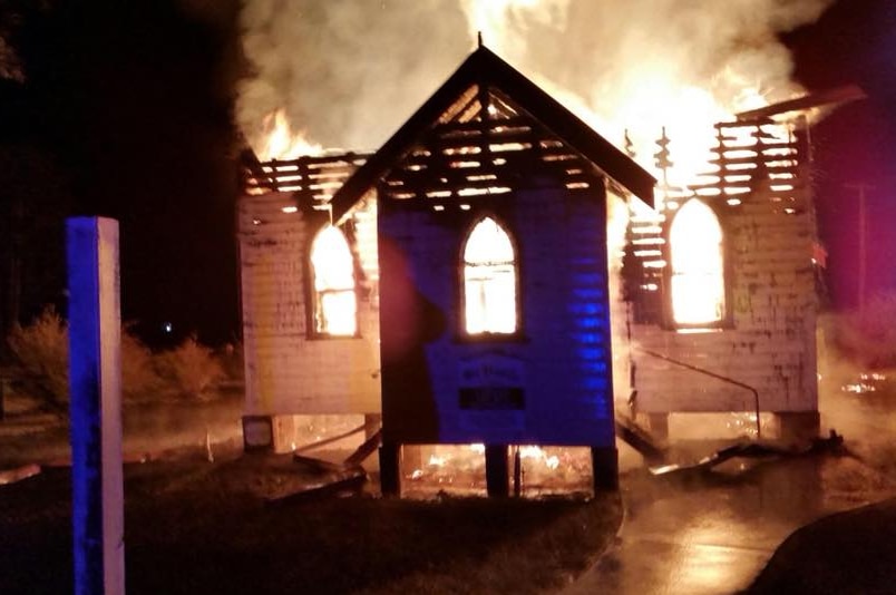 Before sunrise shows a fire engulfing a small wooden church