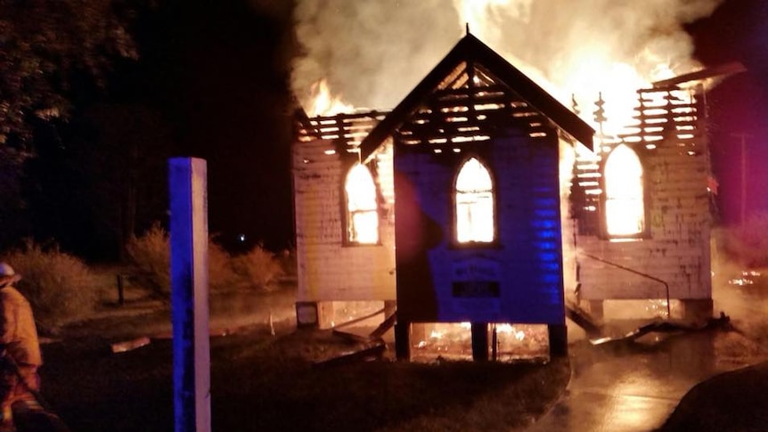 Before sunrise shows a fire engulfing a small wooden church
