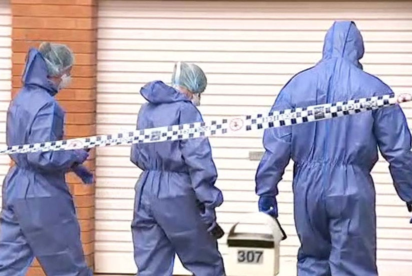 Forensic officers outside a house in Rockhampton where a woman body was found in suspicious circumstances.