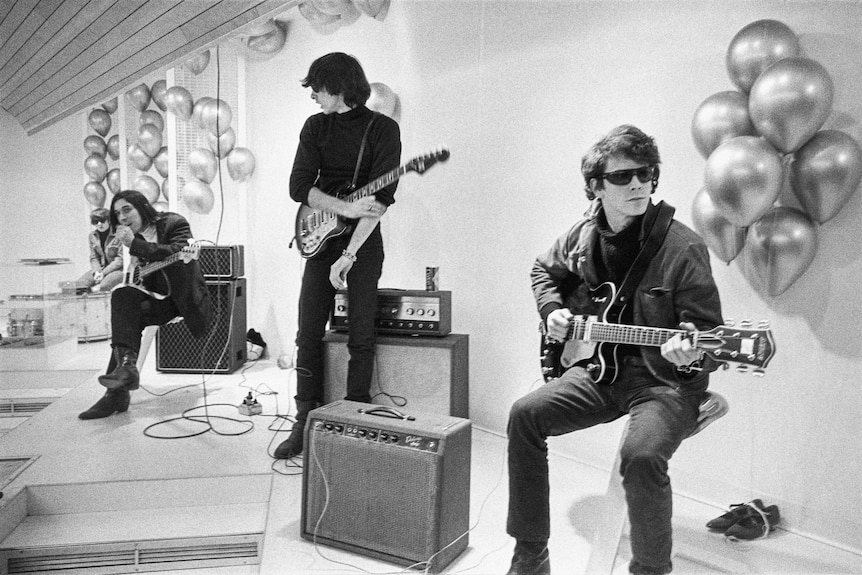 The Velvet Underground on stage, with Moe Tucker on drums, John Cale on bass, and Sterling Morrison and Lou Reed on guitar