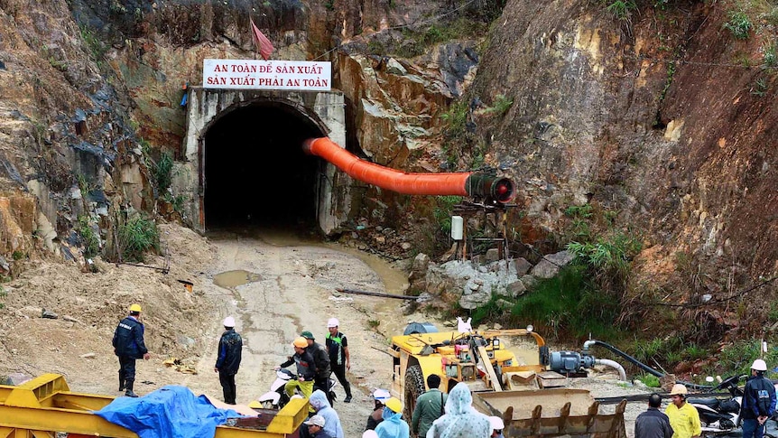 Rescue workers outside a collapsed tunnel in central Vietnam
