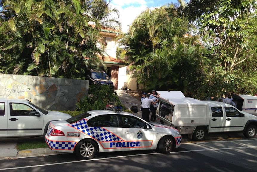 Queensland Police cars outside Pacific Pines home of married couple found dead