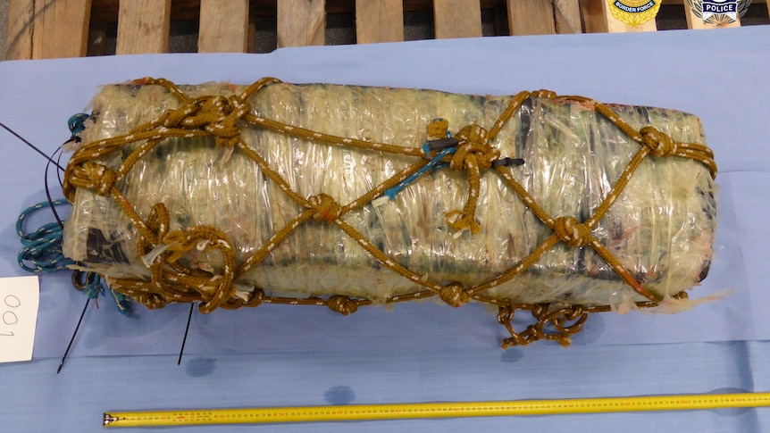 large wrapped parcel tied with rope 