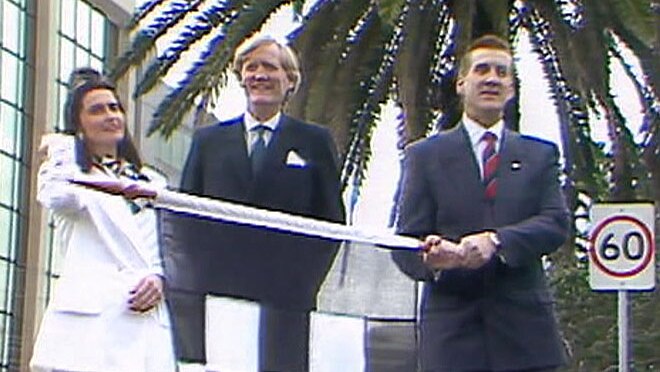 Jeff Kennett (right) with Ron Walker holding the flag at the start of the Grand Prix.