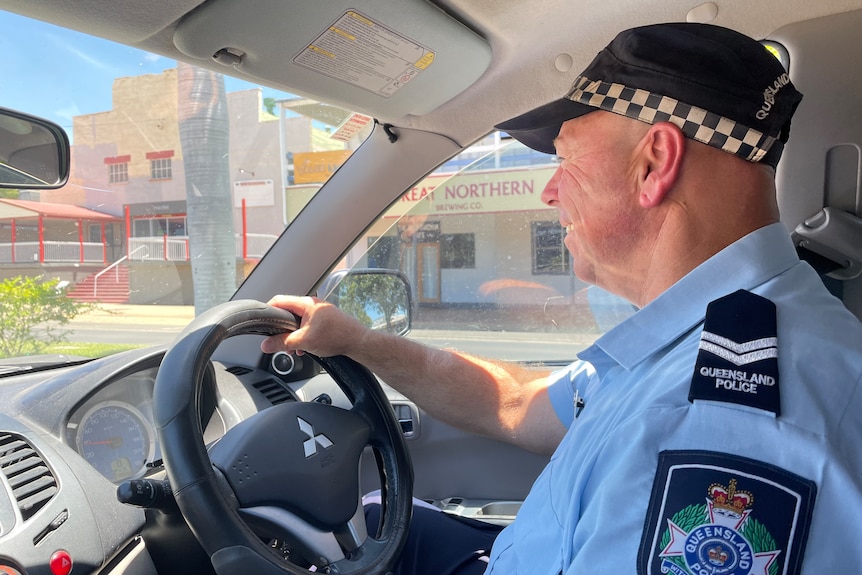A policeman driving a car