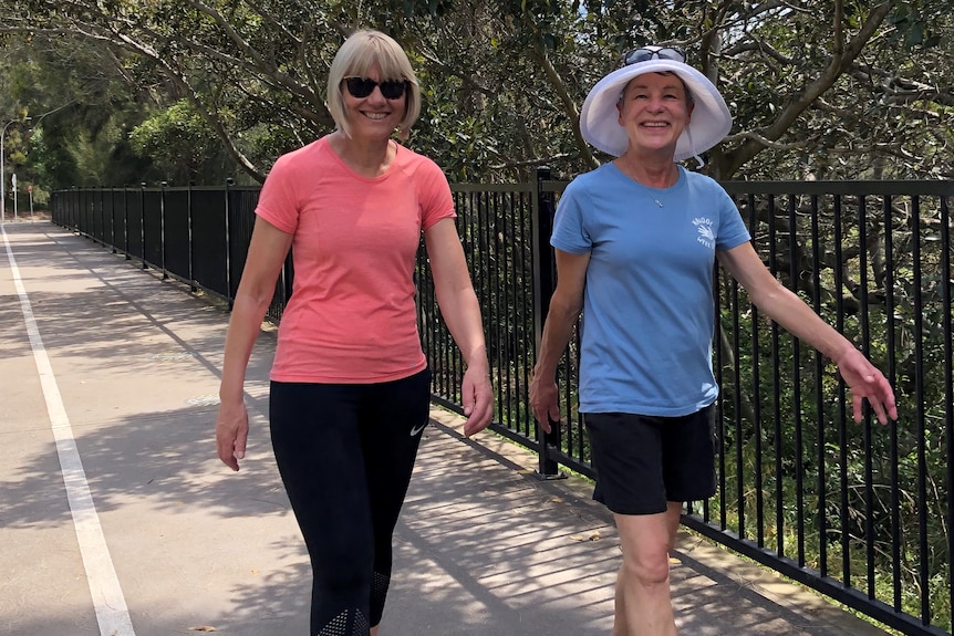 Two women walking on a path through Sydney's Drummoyne.