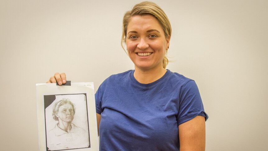 Alethea Beetson with the drawing of her grandmother.