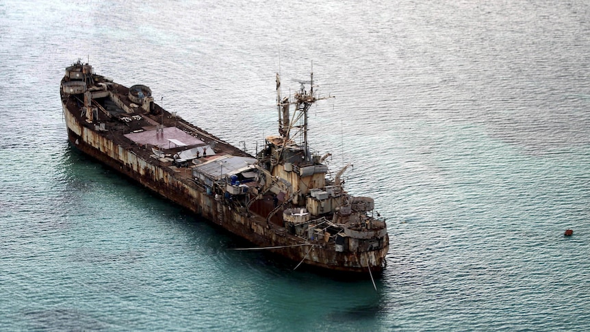 An aerial shot of a dilapidated old warship. 