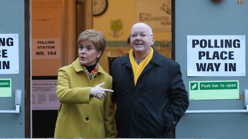 Former Scottish First Minister Nicola Sturgeon poses for the media with husband Peter Murrell.