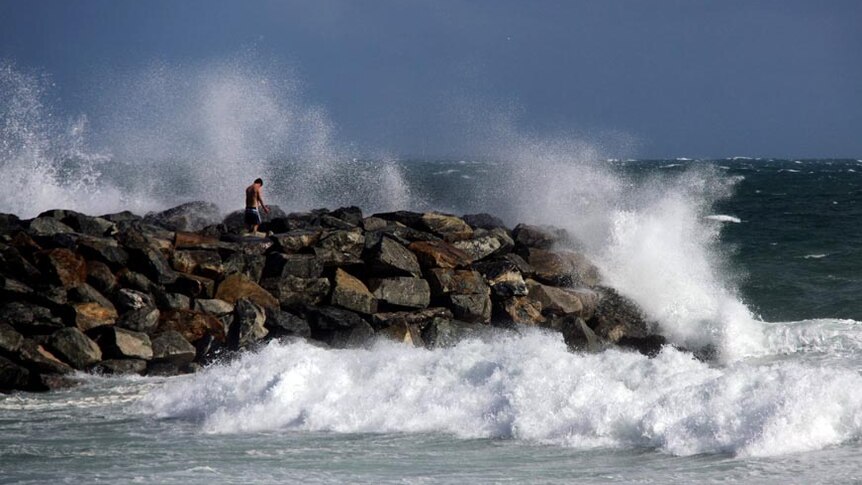 Waves generated from storms lash the coast.