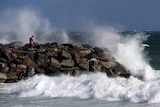 Waves generated from storms lash the coast.