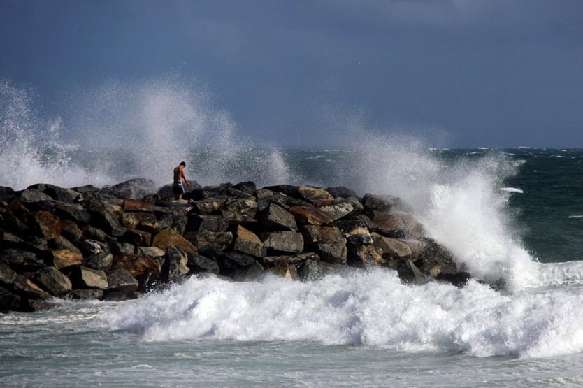 Waves generated from storms lash the coast.