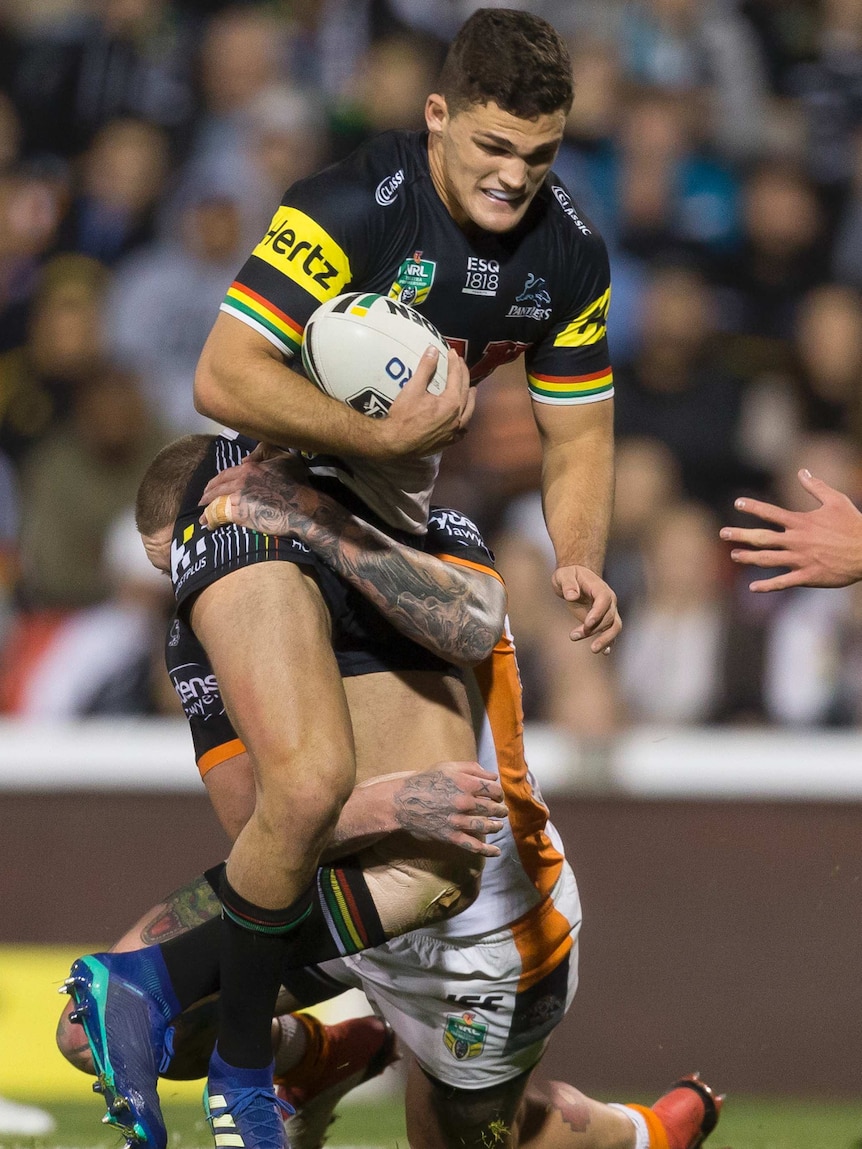 Nathan Cleary is tackled by the Wests Tigers.