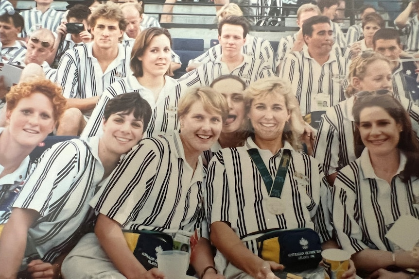 groups of Australian olympians in a grandstand