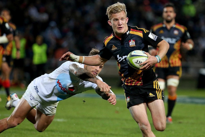The Bulls' Francois Hougaard misses a tackle on the Chiefs' Damian McKenzie in Rotorua.