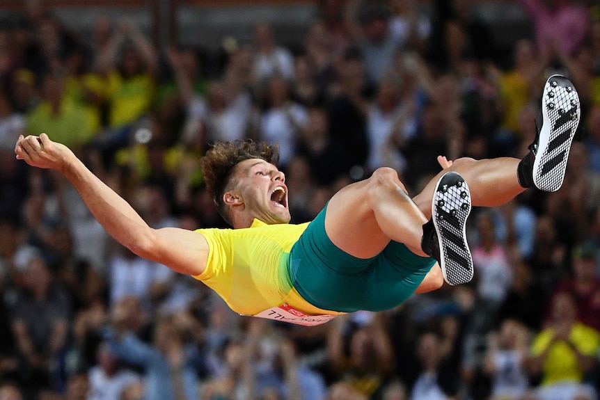Kurtis Marschall of Australia celebrates as he falls to the mat.