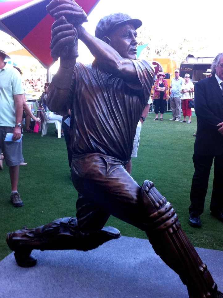 People look at a statue of Darren Lehmann at the Adelaide Oval.