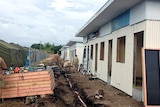 The toilet/shower blocks being built next to tents on the island of Nauru.