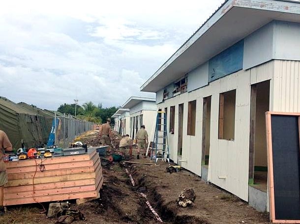 The toilet/shower blocks being built next to tents on the island of Nauru.