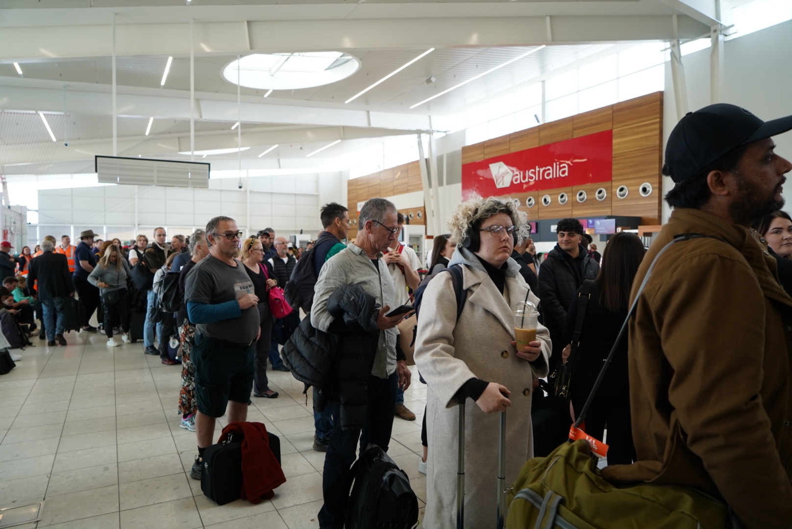 A crowd of people at Adelaide Airport.