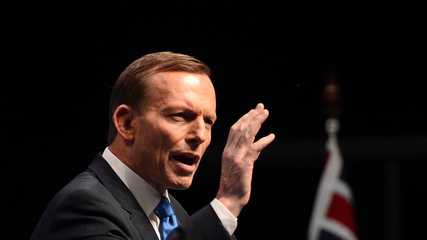 Tony Abbott speaks and gesticulates during Coalition election launch in 2013.