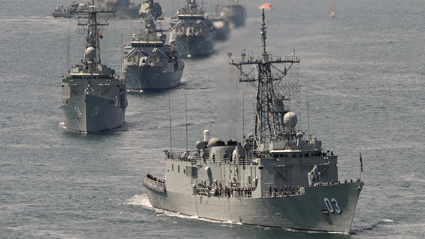 HMAS Sydney leads the Royal Australian Navy fleet through Sydney Harbour