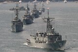 HMAS Sydney leads the Royal Australian Navy fleet through Sydney Harbour
