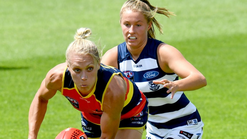 Erin Phillips of the Adelaide Crows handballs against Geelong.