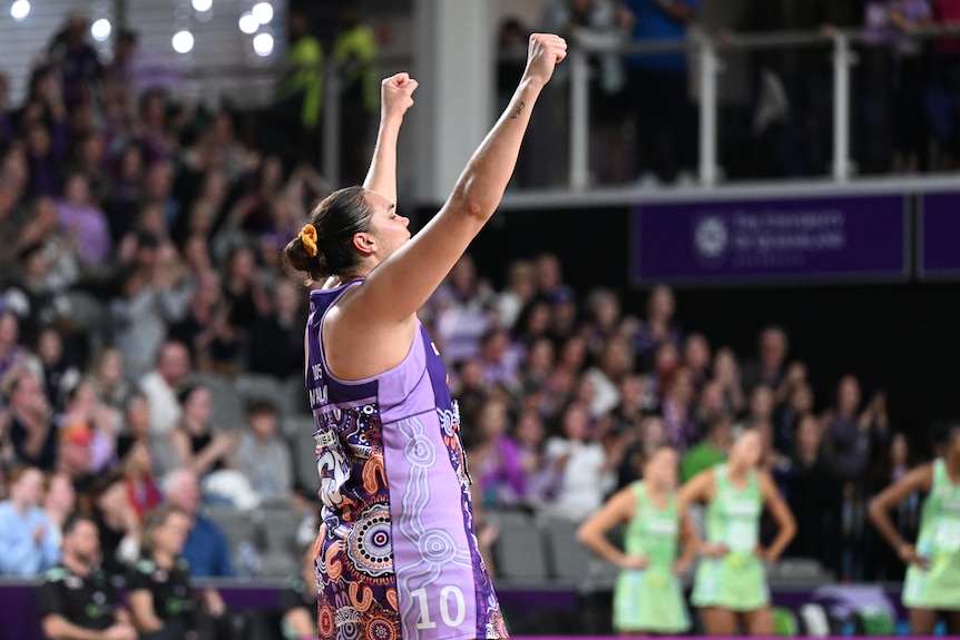 Donnell Wallam throws both hands up in the air as she scores a super shot