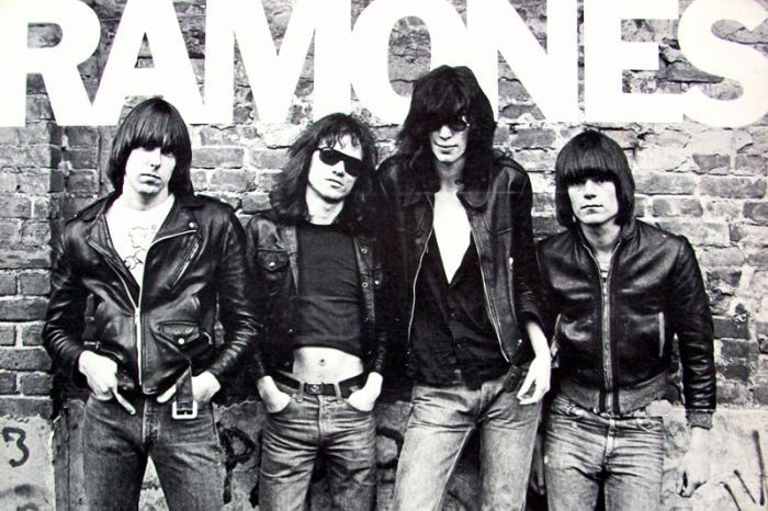 Black and white photo of four band members with Ramones printed at top of image.