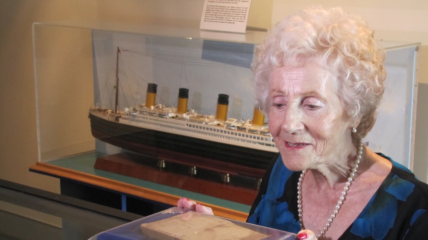 Joy Lester looks at her mother's address book. The book is on display at Brisbane's Queensland Maritime Museum.