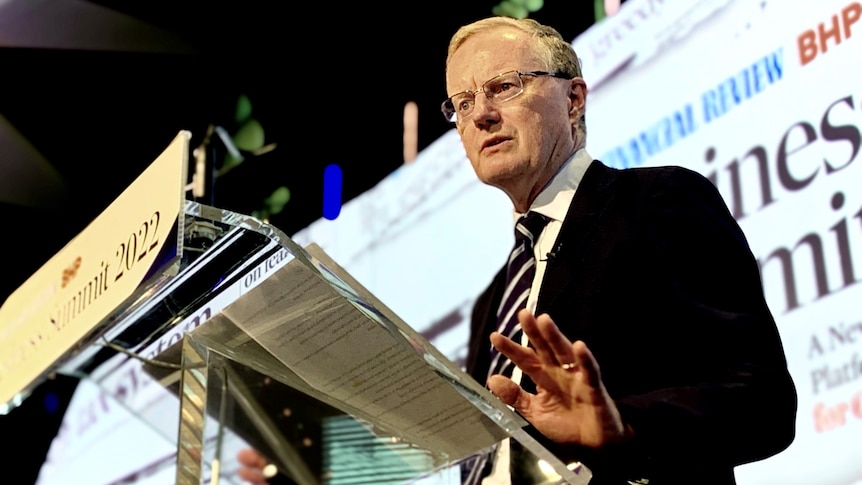 Reserve Bank Governor Philip Lowe speaks at the AFR Business Summit at a lectern.