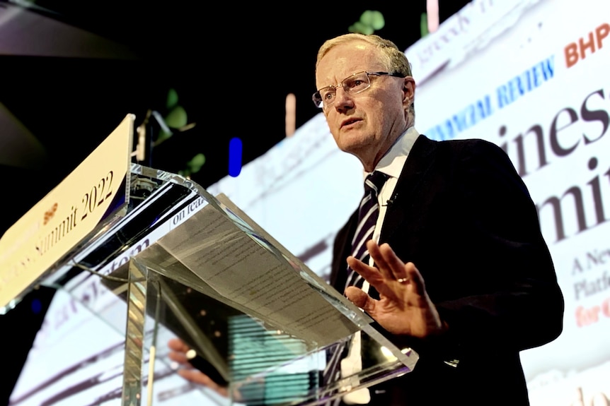 Reserve Bank Governor Philip Lowe speaks at the AFR Business Summit at a lectern.