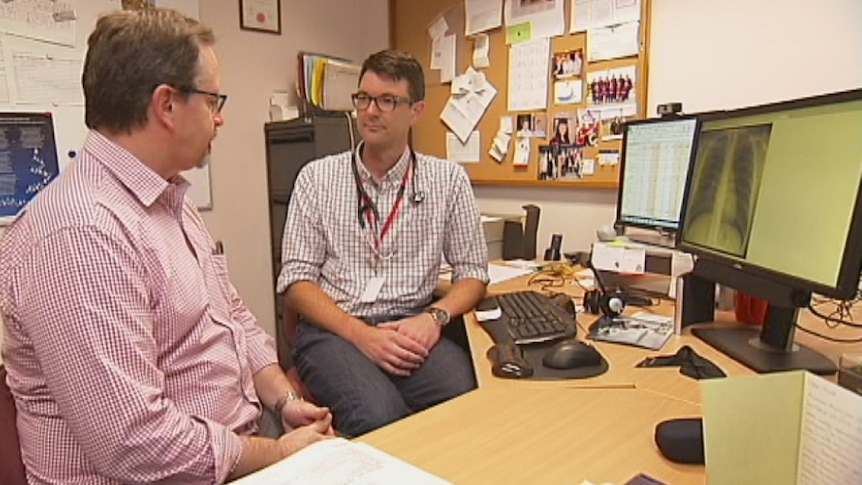 Dr Bastian Seidel talks to a patient