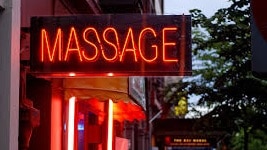 Young boys and girls are being advertised by massage parlours on the Gold Coast.