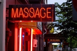 Young boys and girls are being advertised by massage parlours on the Gold Coast.