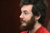 James Holmes listens during his arraignment.