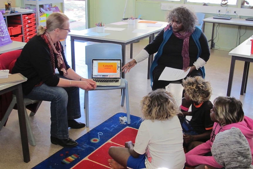 Inge Kral and Lizzie Ellis with Indigenous children