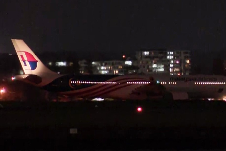 a malaysia airline plane stopped on the tarmac at sydney airport