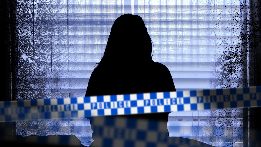 The silhouette of a woman as she stares out the window while sitting on a bed