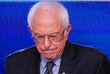 Senator Bernie Sanders looks down during a Democratic debate