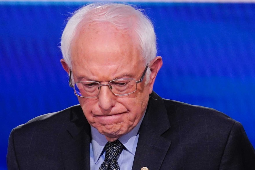 Senator Bernie Sanders looks down during a Democratic debate