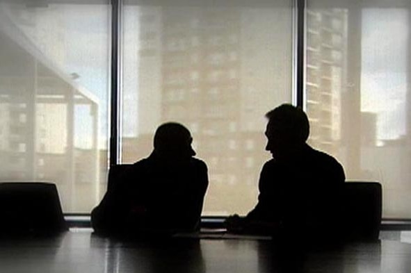 Two people sitting in an office