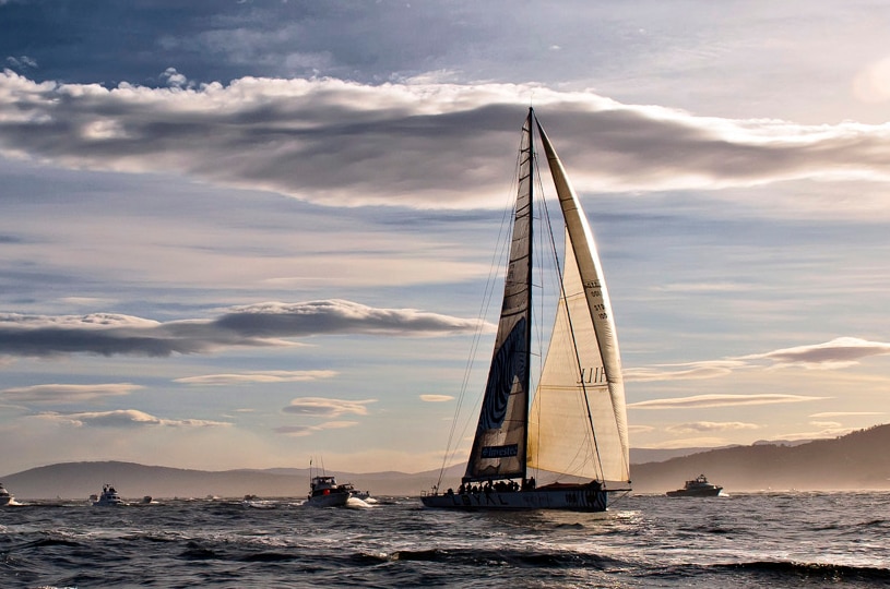 Investec LOYAL crossing the finish line on the Derwent River to win the 2011 Sydney-to-Hobart.