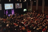 Around 1,000 2020 Summit delegates gather in the Great Hall of Parliament House