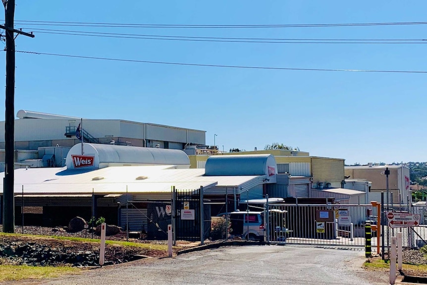 A large factory complex from the road