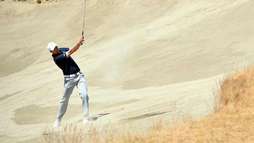 Spieth hits out of the sand