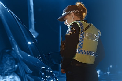 Tasmania Police officer at traffic stop, generic image.