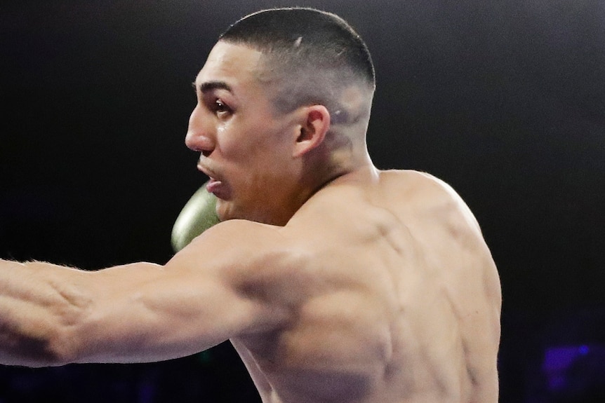 Teofimo Lopez punches an opponent in the body